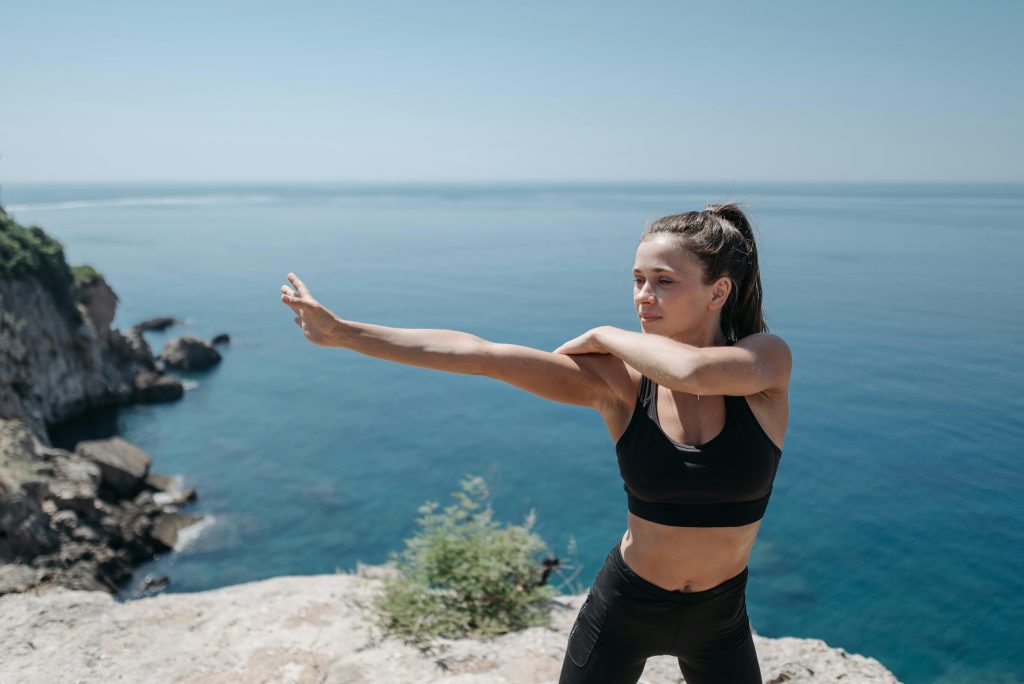 magical forest at dawn, ancient trees with twisted roots and vibrant green leaves, sunbeams filtering through the dense canopy, illuminating a carpet of moss and ferns, ethereal glow creating an enchanting atmosphere, mystical creatures like fairies and sprites hidden among the foliage, serene and tranquil environment, air filled with the sweet scent of blooming flowers and the sound of gentle rustling leaves, sense of wonder and magic, illustration, rendered in 8K resolution with Procreate, intricate details and soft lighting, no dark or sinister elements, no modern structures or technology, no aggressive or violent creatures.